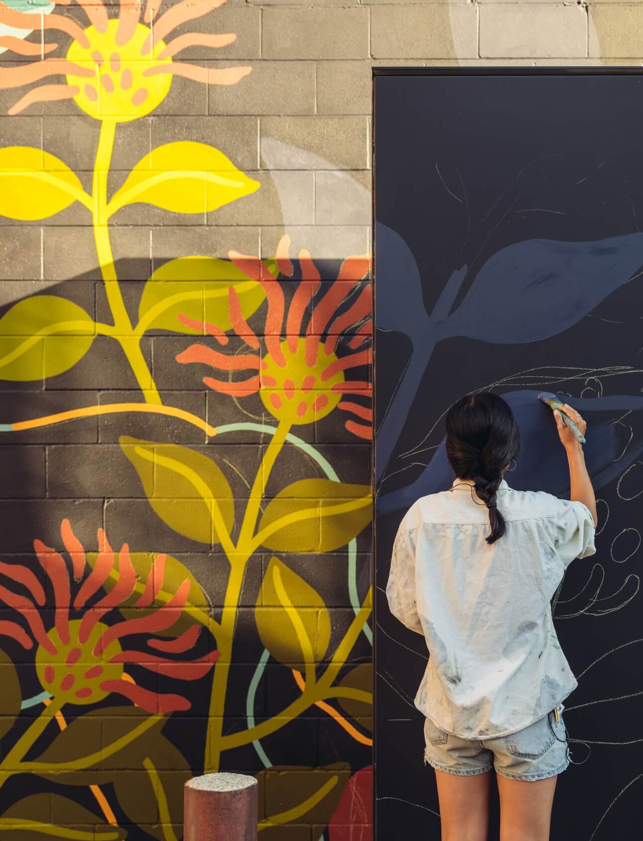 An artist painting a mural.